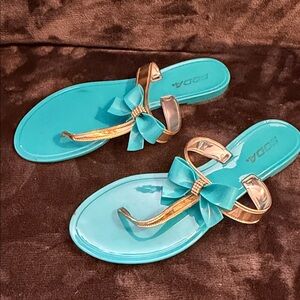 Soda Teal Bow Thong Sandals with Metallic Gold Straps